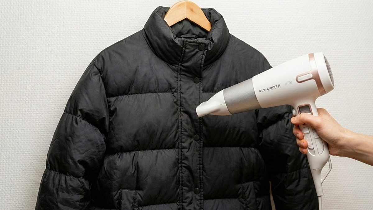 헤어드라이기로 패딩 발수 기능을 복원하는 모습 / AI 생성 이미지