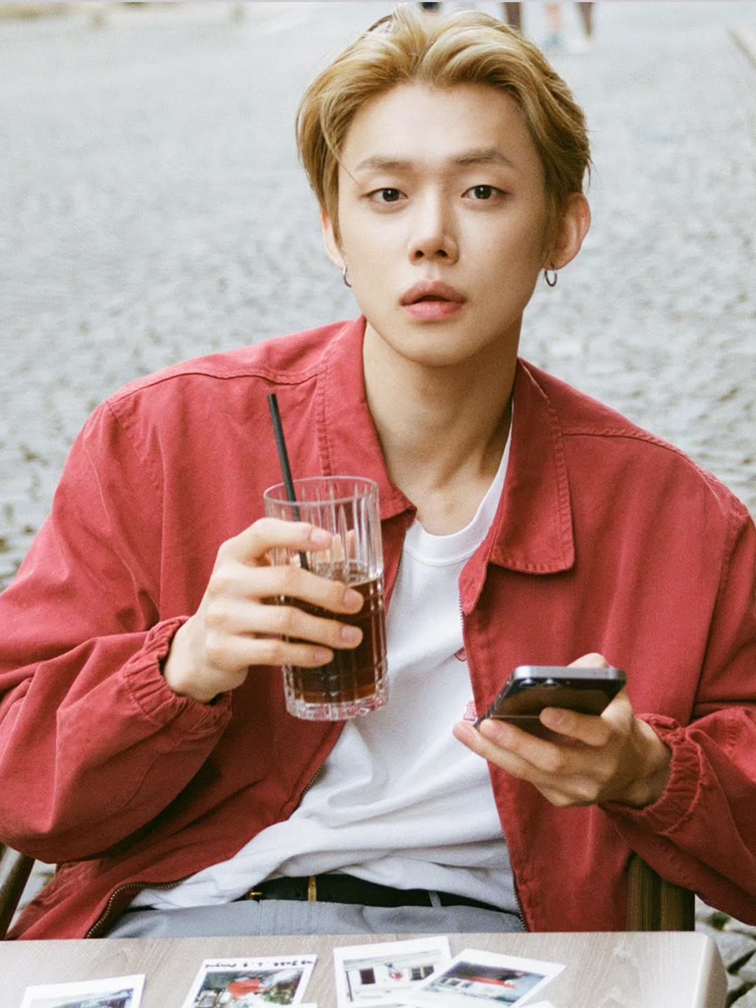 Yeonjun posing while holding a beverage / Yeonjun Instagram