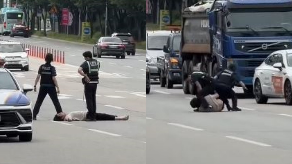 여성 경찰관이 도로에 누운 난동범을 몸으로 눌러 제압하려다 중심을 잃고 넘어지고 있다. / 유튜브 채널 ‘코코파’ 캡처